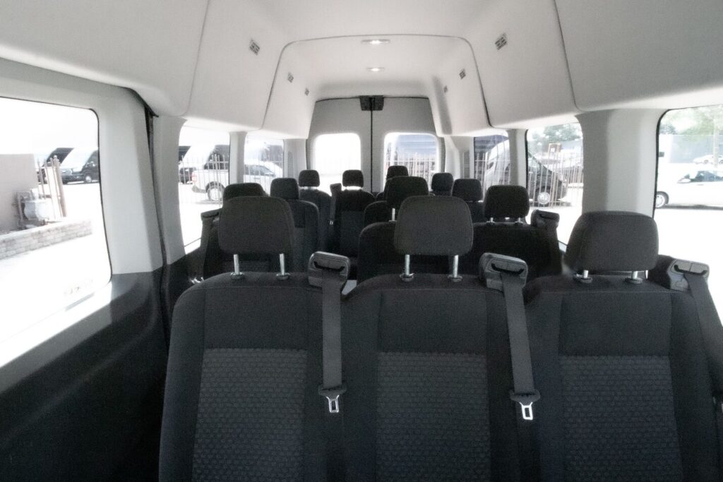 Inside a black 12-passenger van