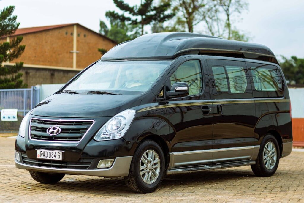 A sleek black passenger van