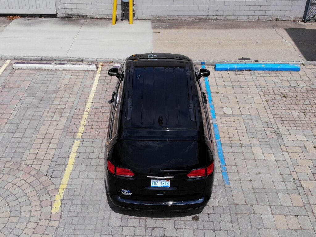 A sleek black passenger van