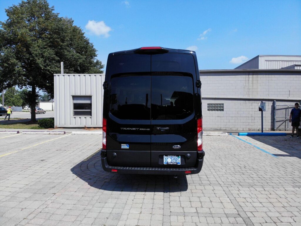 black passenger van on highway