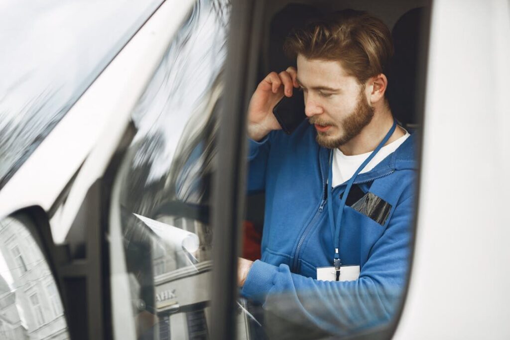 person booking van on phone